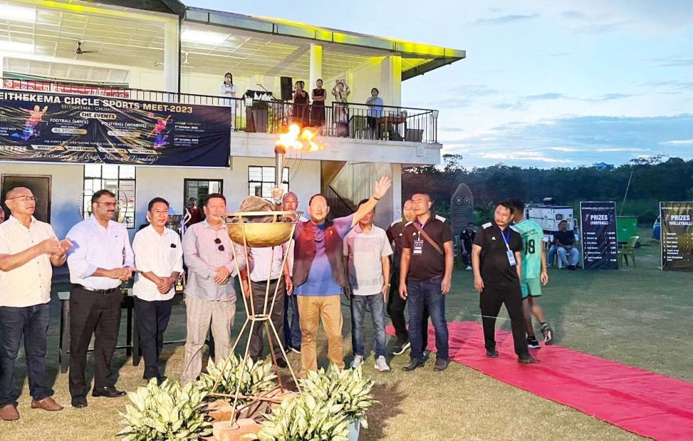 (Left) Advisor Zhaleo Rio lighting the ceremonial lamp during the inaugural function of Seithekema Circle sports week at Sovima Cricket ground, Chümoukedima on October 3. (Right) A team arriving during the inaugural function. (Morung Photo)